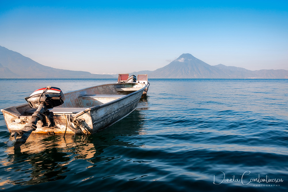 Small boat on the blue waters of Lake Atitlan